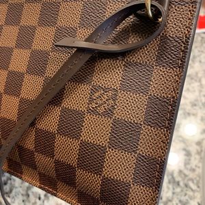 LV wristlet used some dirty spots inside not very visible look at pictures.